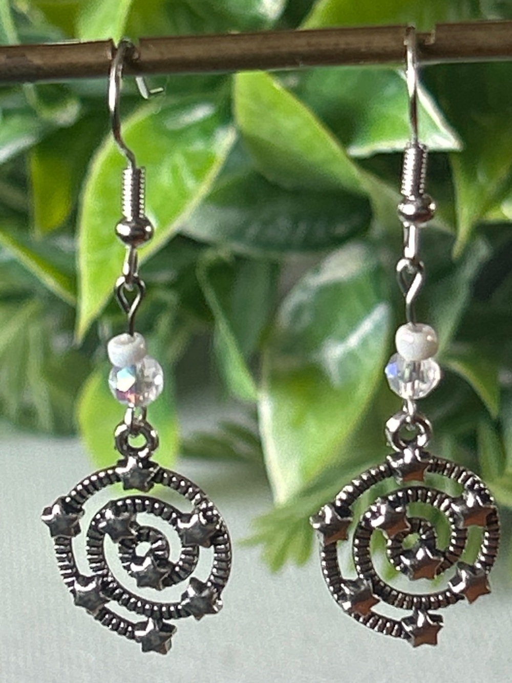 Handmade Silver Star Spiral Drop Earrings with White Bead Accent